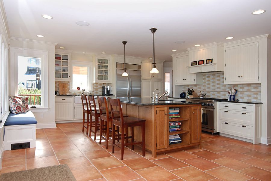 A room with Saltillo Tile and Wooden Furniture 