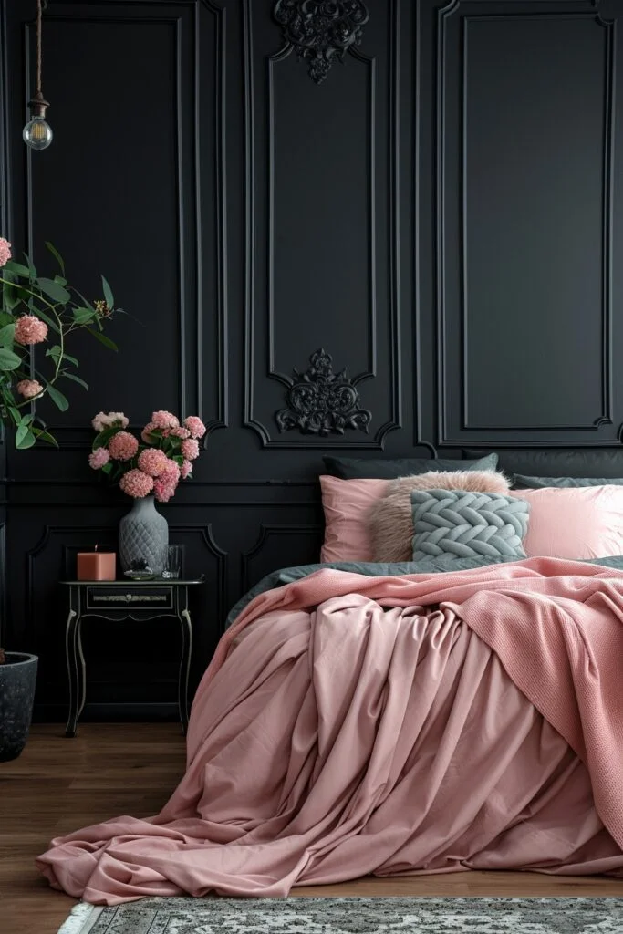 A living room in soft blush pink accent against black backdrop