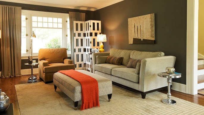 A living room with area rugs and recliner sofa 