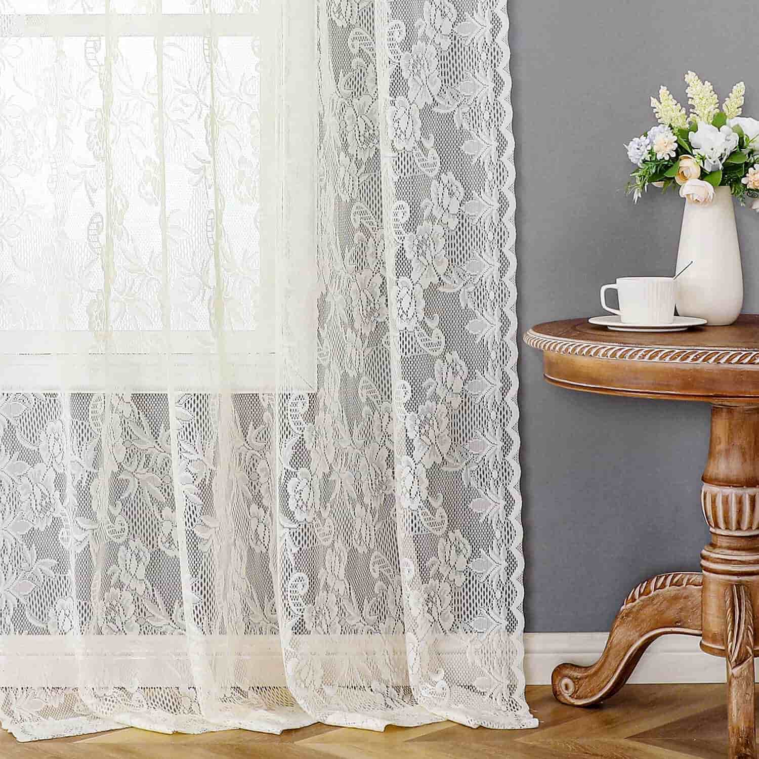 A living room with sheer curtain with delicate lace trim 