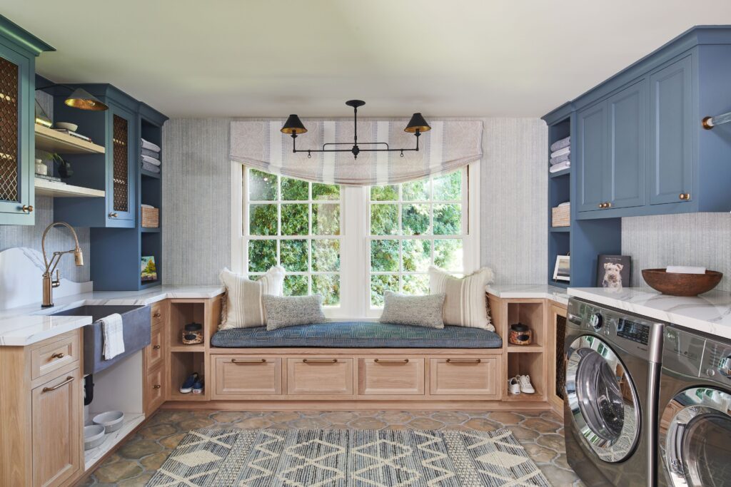 A laundry room with art and geometric designs 