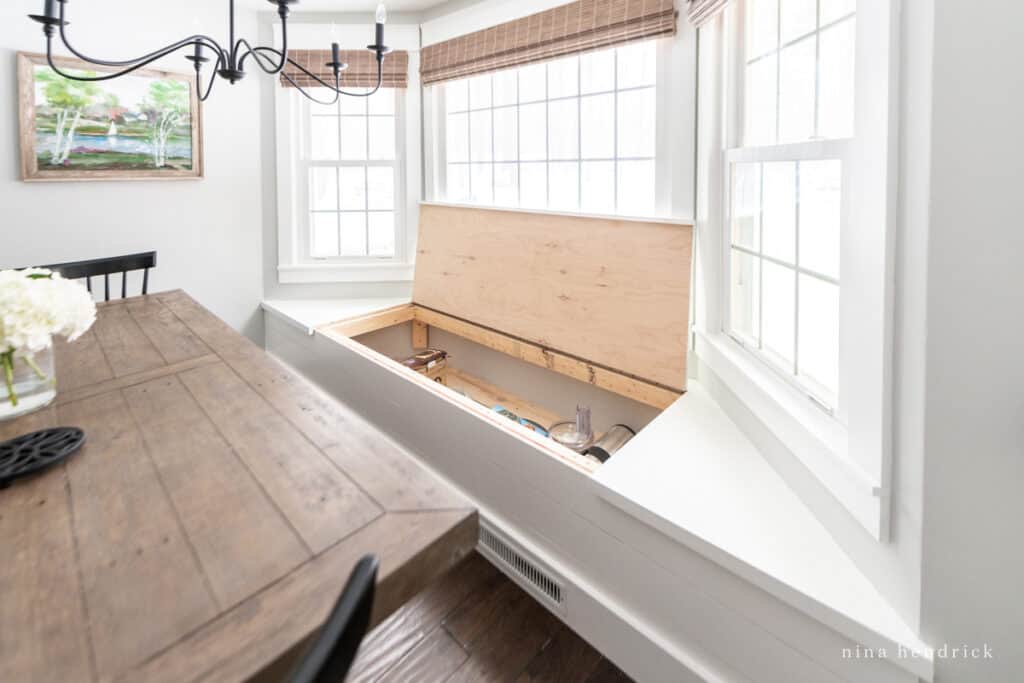 A living room with bench with hidden compartment 