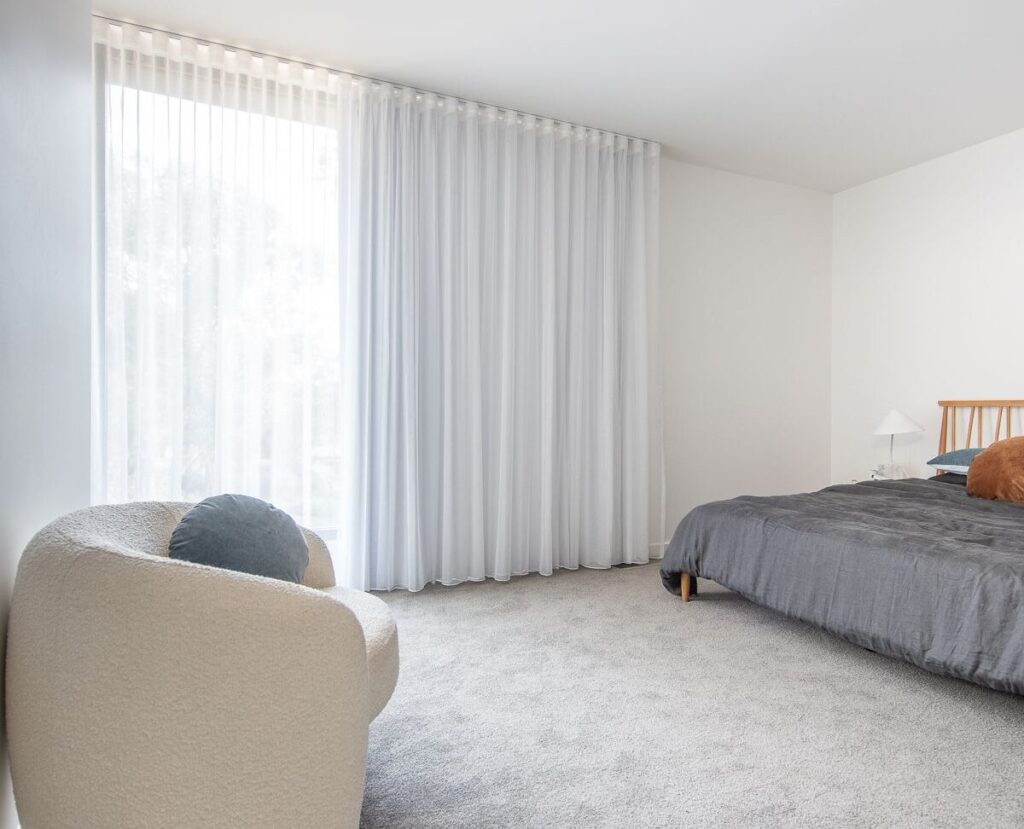 A living room with sheer curtains and blackout lining 