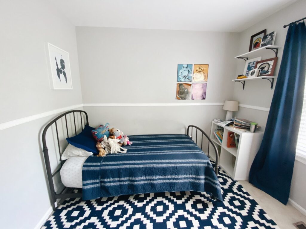 A shared living room with bold bedspread 