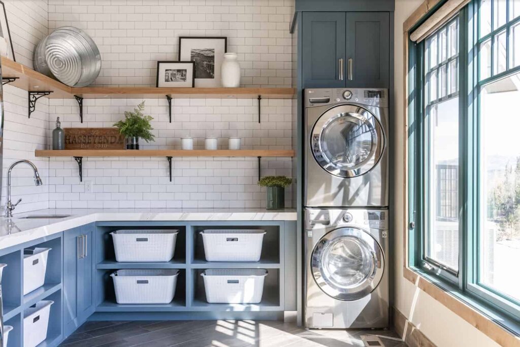 An outdoor space for laundry with countertops and cabinets 