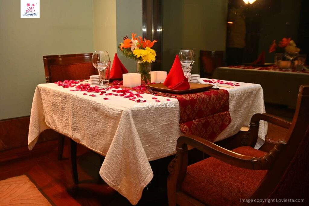 A hotel room with in-room dining setup 