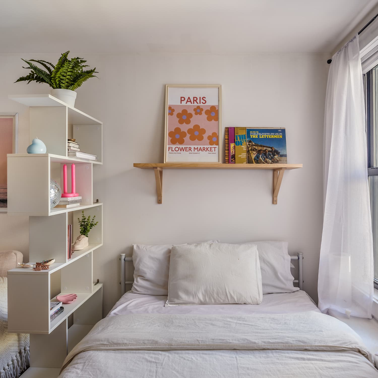 A shared room for a boy and a girl with floating shelves 