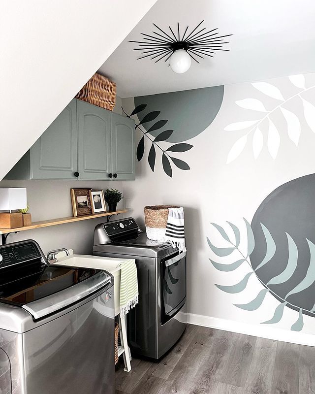 A laundry room with hand-painted murals 