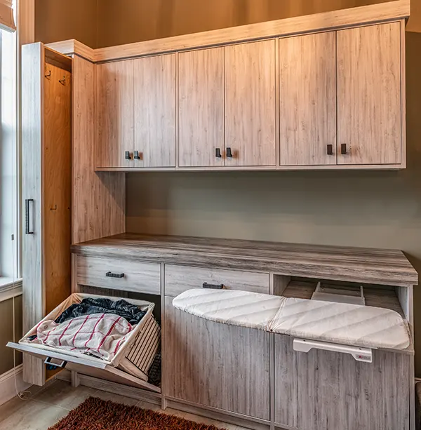 An outdoor space for laundry with built-in ironing board 