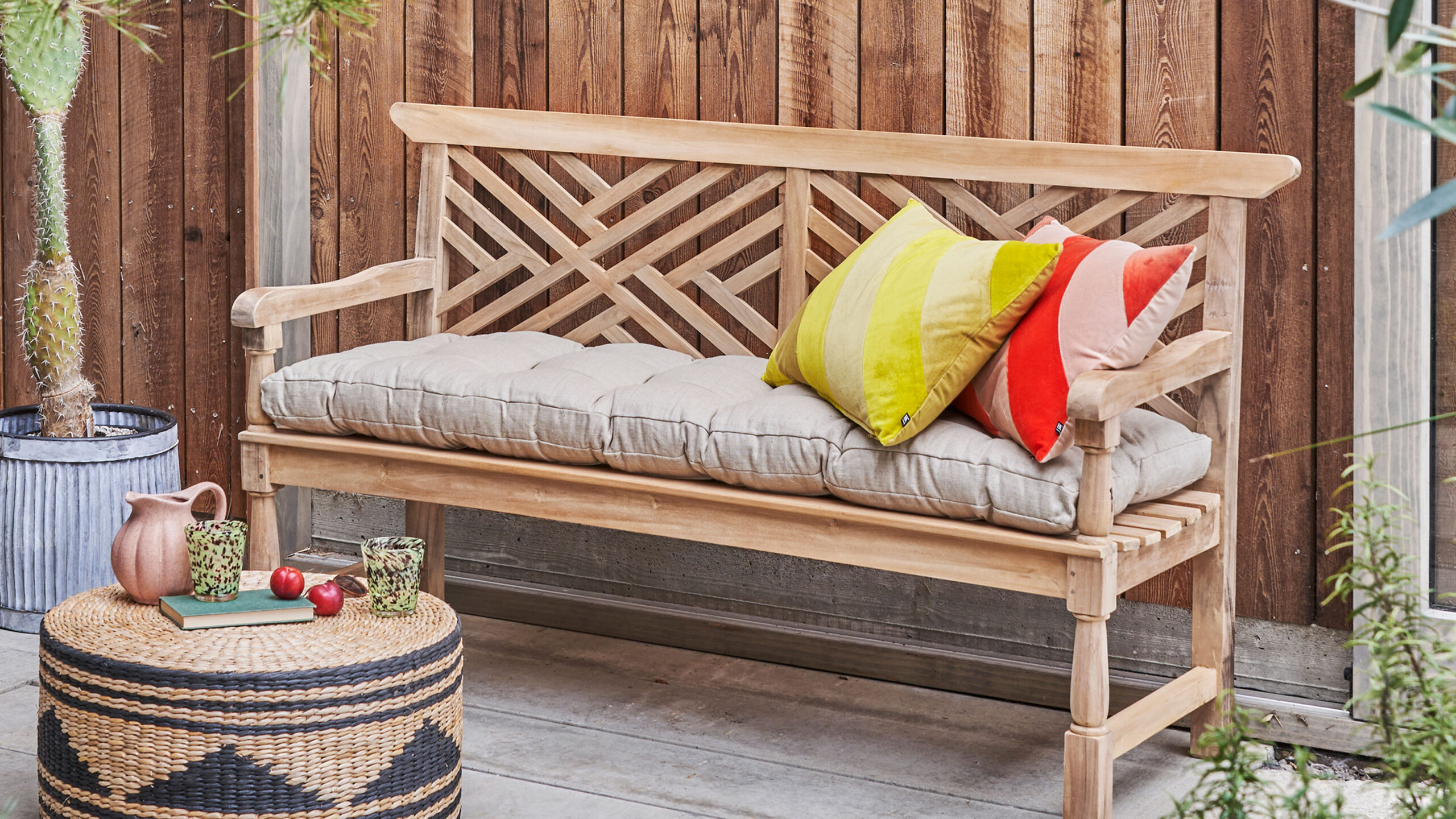 A living room with outdoor inspired bench 