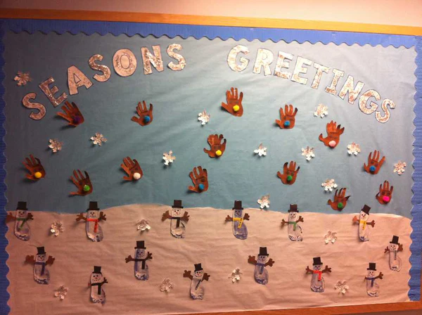 A bulletin board with seasonal art theme in a room 