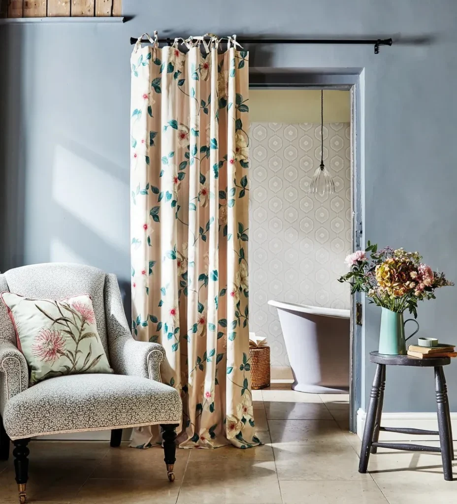 A living room with tie-top sheer curtains 