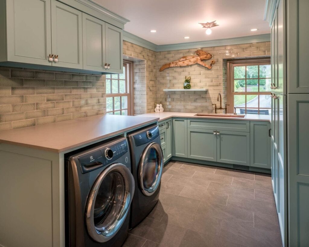 A laundry room with vibrant tiles 