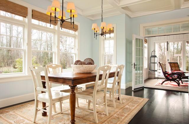 White color window frames ad cream rug underneath the dining set