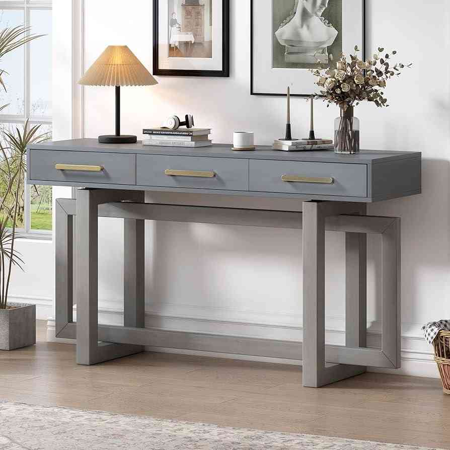 Wooden grey console table with a lamp and a flower pot placed on it