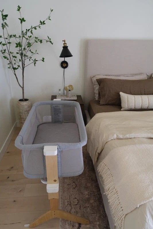 Grey and wooden mini bassinet for the baby