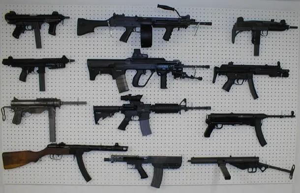 A white pegboard to display guns in room