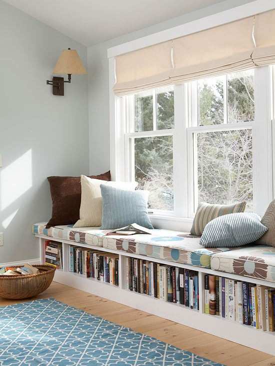 Window bench seating with storage underneath it for the books