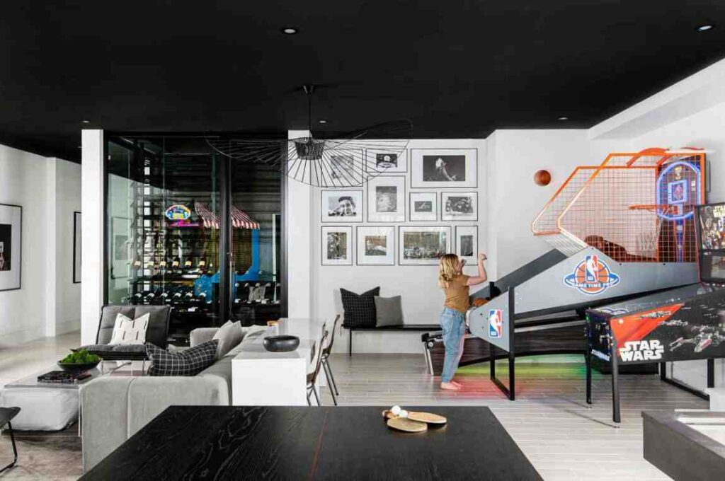Black and white theme for arcade game room with a basketball table