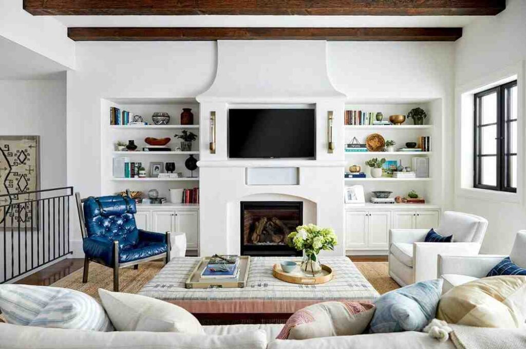 White built-in wall storage for extra storage in a living room