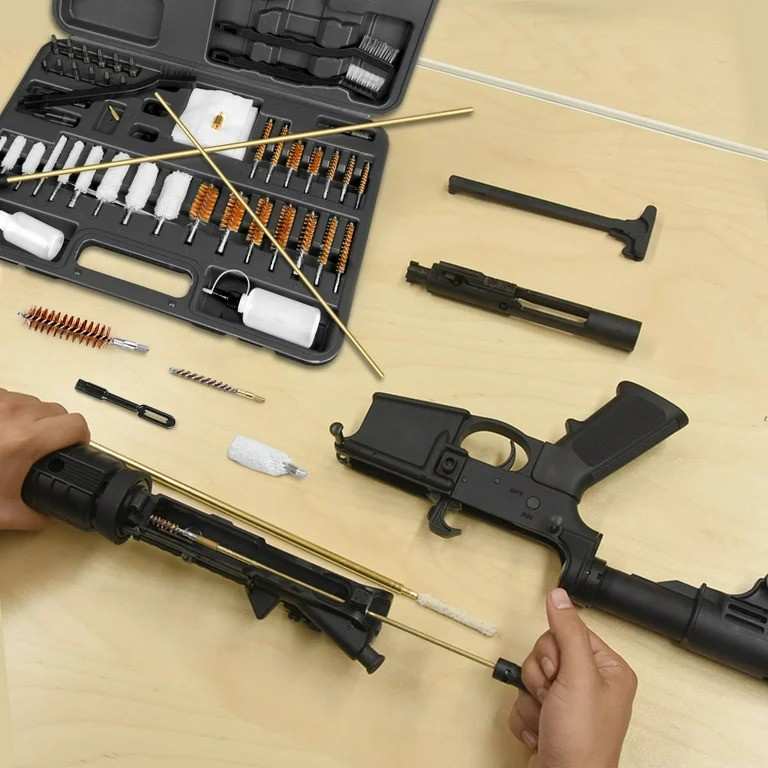 A cleaning kit for guns on a wooden table to clean guns parts