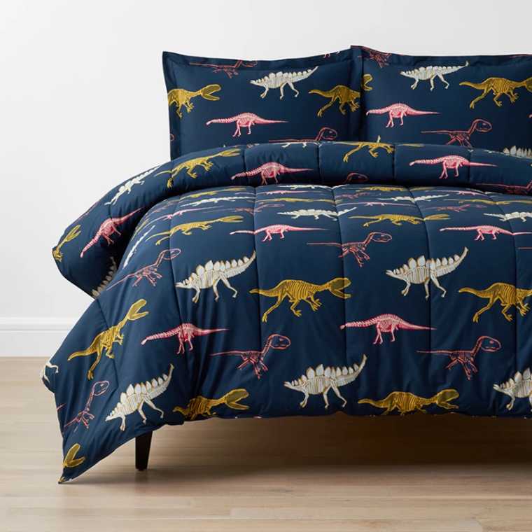 Dark blue color duvet set with colorful dinosaur prints on it