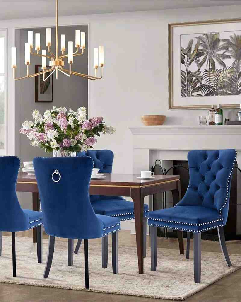 Dark blue color velvet chair with a hook behind it attached