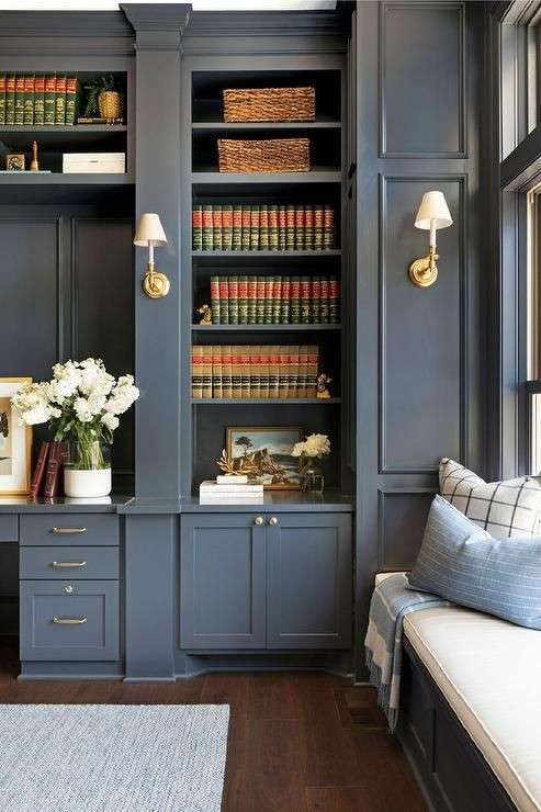 French wooden built-in cabinet in dark gray color with book placed in it