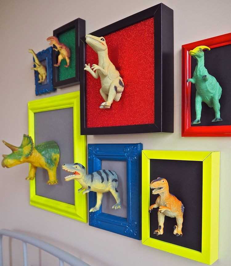 Frames with dino toys cut out pasted on it