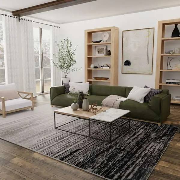 Gray and white stripped fur rug placed under the table and sofa in living room