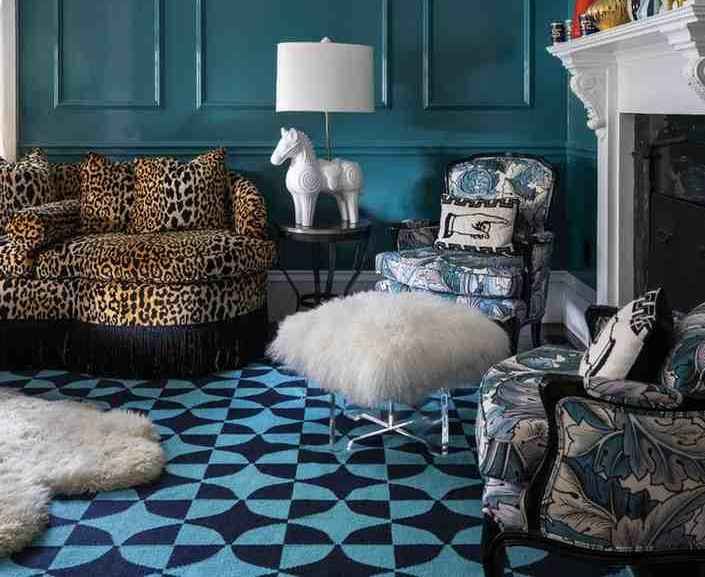 Patterned rug laying on floor in a living room