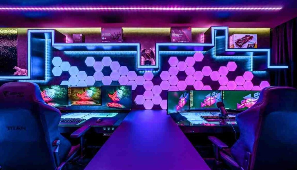 Multi color light fixture behind the PC and around the room