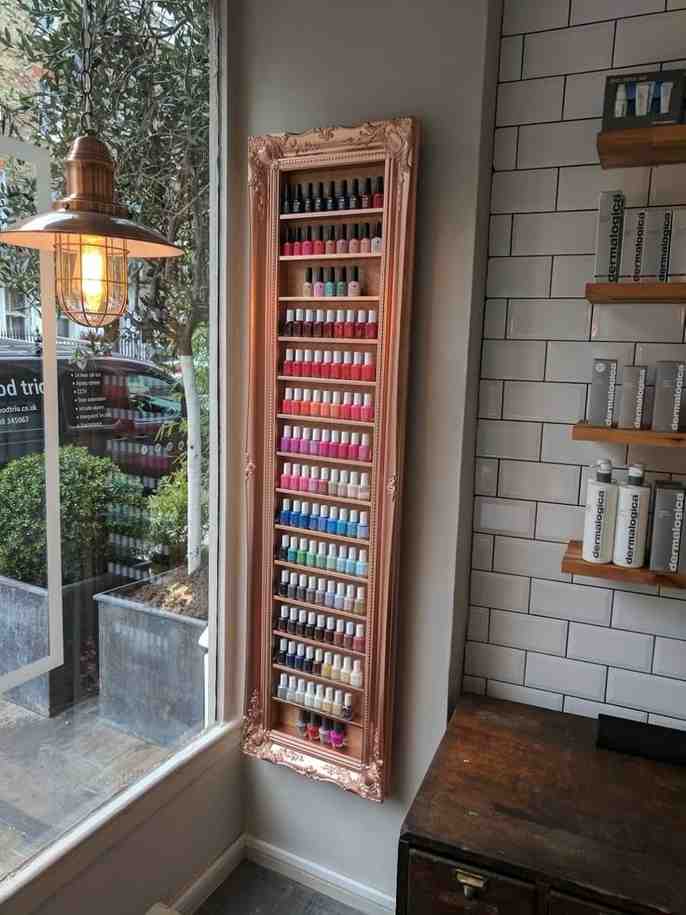 Rose golden vertical storage wall built in for nail polish