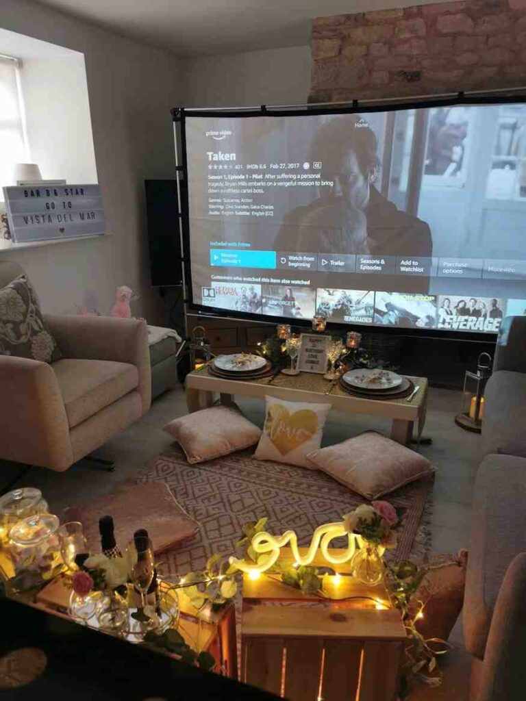 A movie night set up at hotel room floor