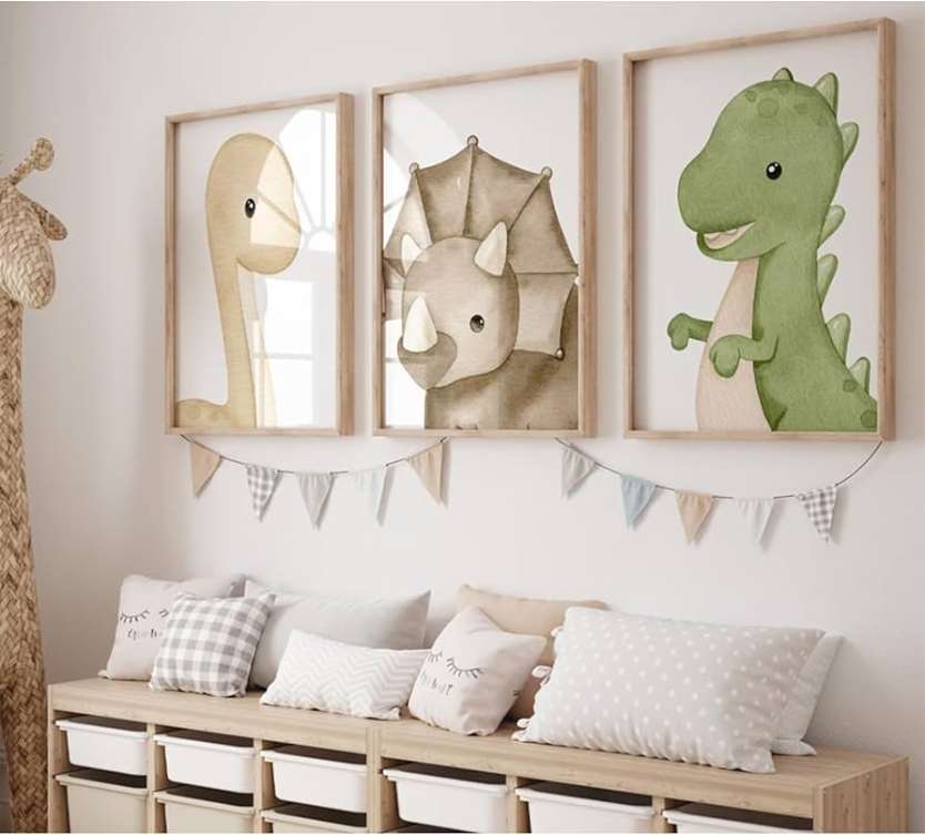 Three wooden framed dinosaur painted poster above a wooden cabinet