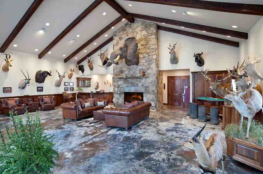 Bricked accent fireplace in the middle of the room and some plants around the room