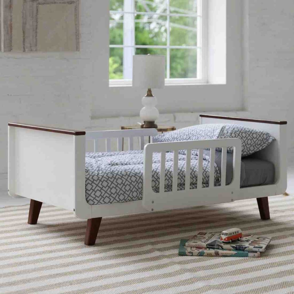White and brown wooend frame convertible bed for toddler