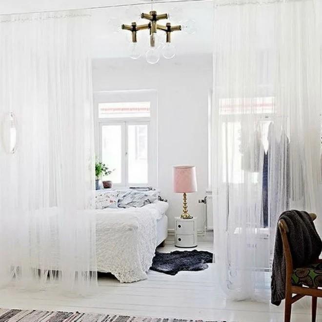 White sheer curtain for separation