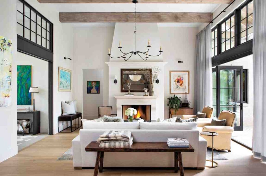 White wall and cream sofa and a wooden bench behind it in living room