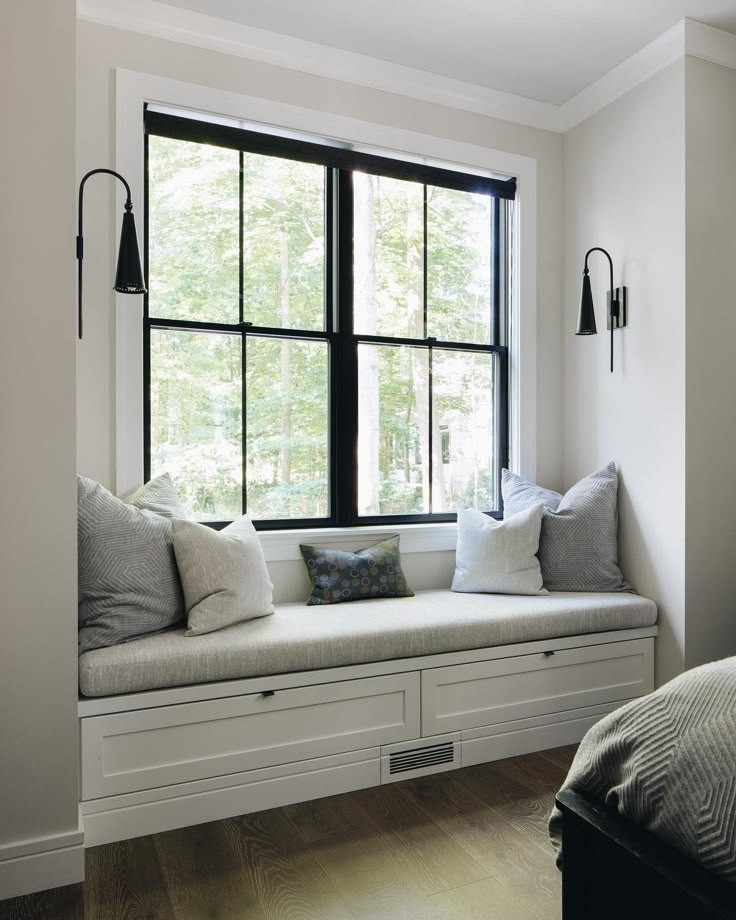 White wooden frame and wall with a window bench seating