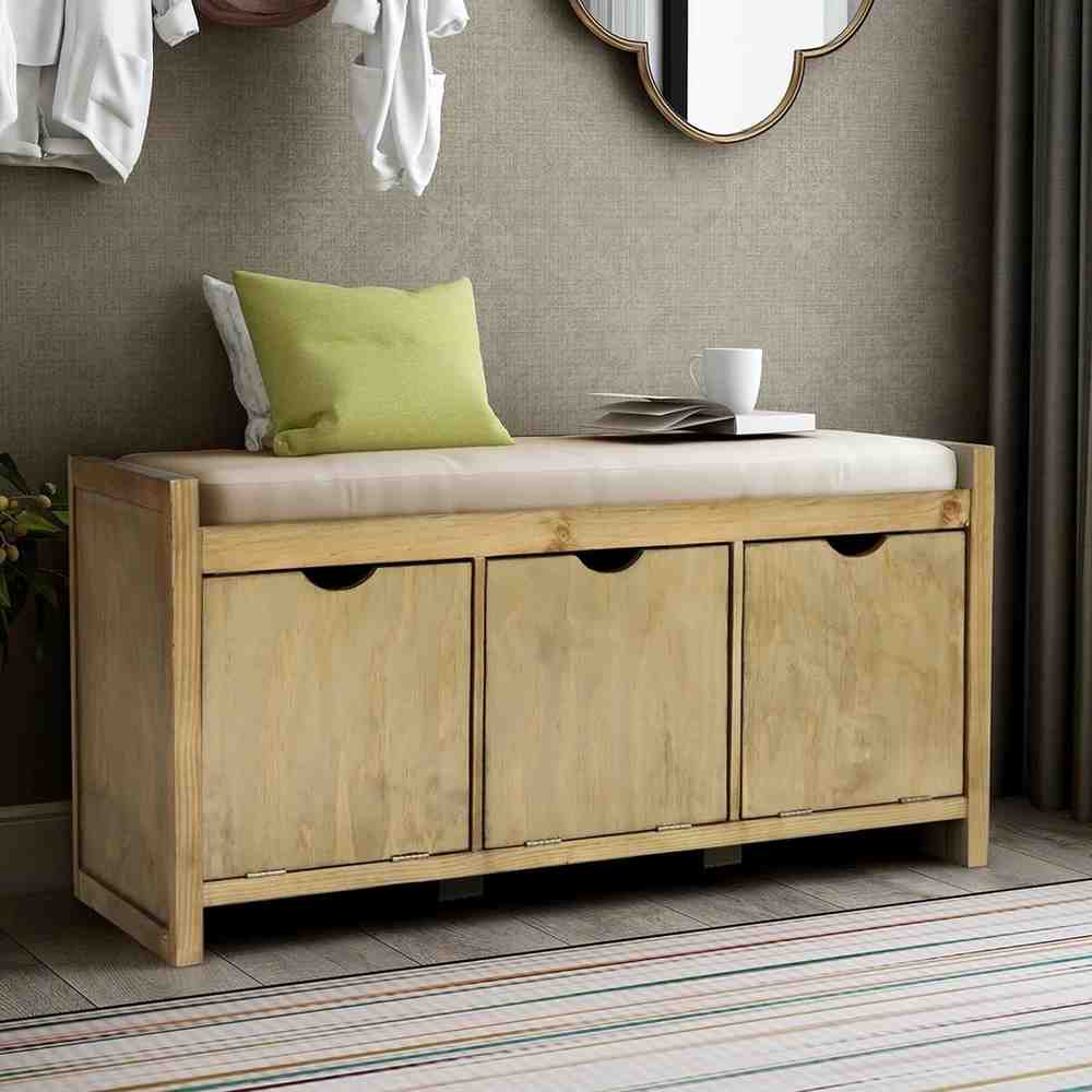 Wooden bench with a storage built-in and pillow placed on it