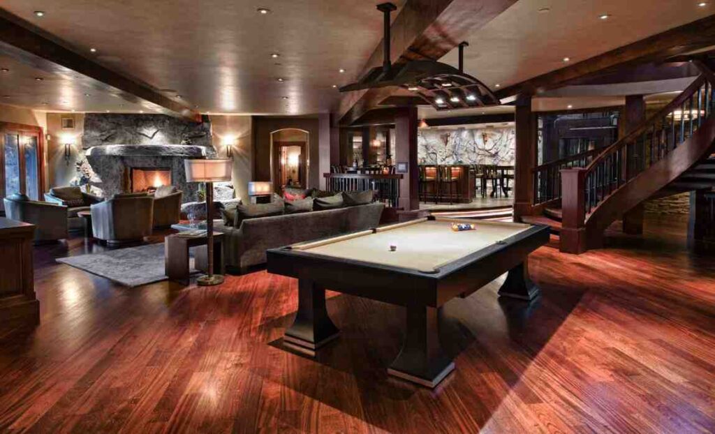Grey walls and ceiling and dark brown furniture with comfortable seating area