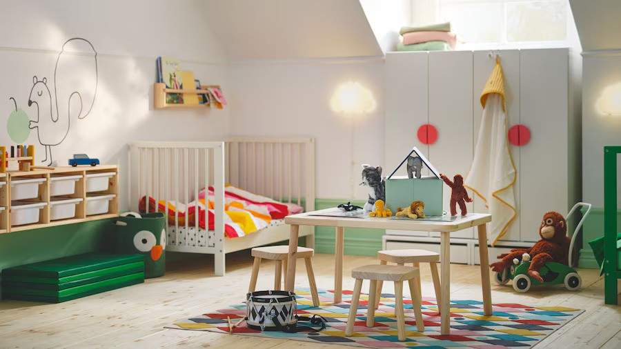 Mini wooden table and chair set and a corner crib for the toddler