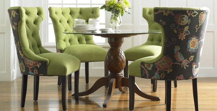 Floral and solid color two toned dining room chair with a glass top table