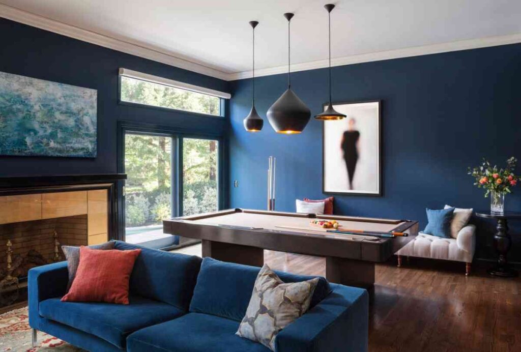 Teal walls and furniture with cream ceiling for the game room