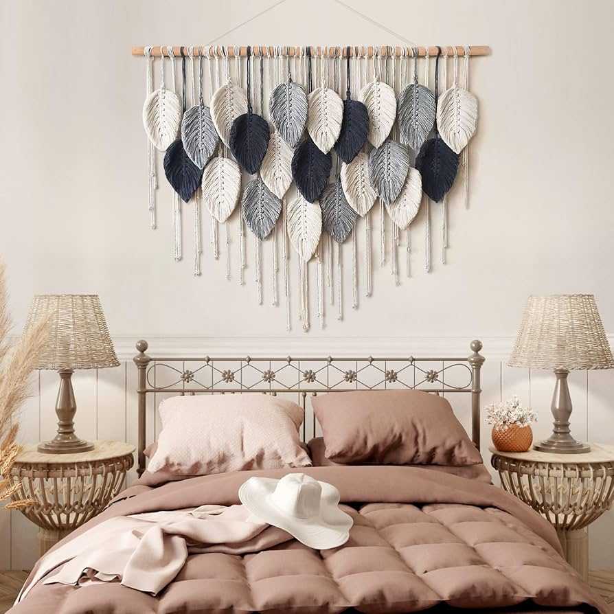 A blue and white feather shape macrame hanging and metal bed frame with two side lamps