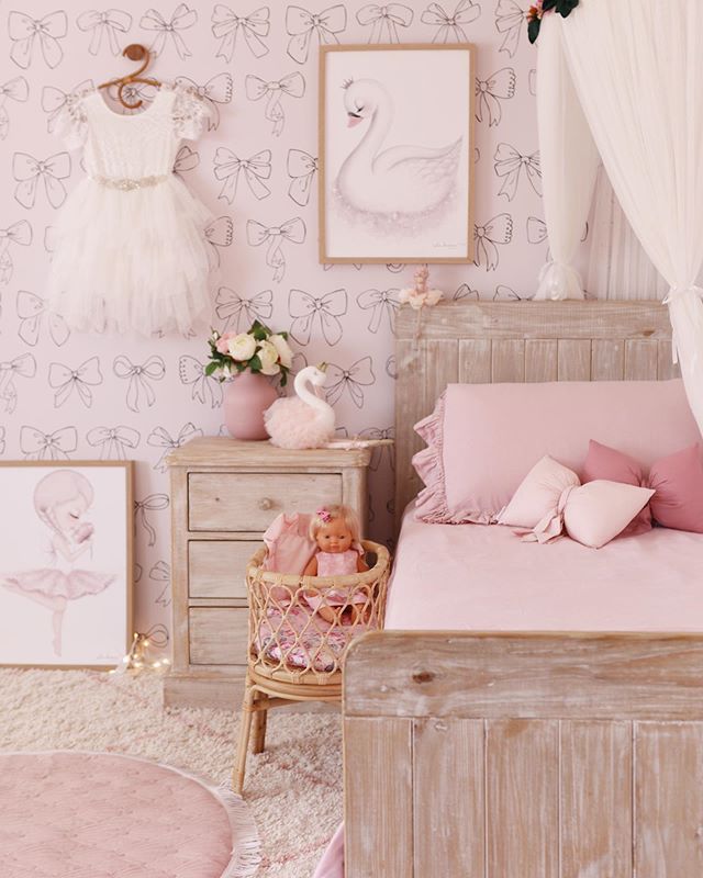 Pink and black color bow design wallpaper and a pink bow pillow