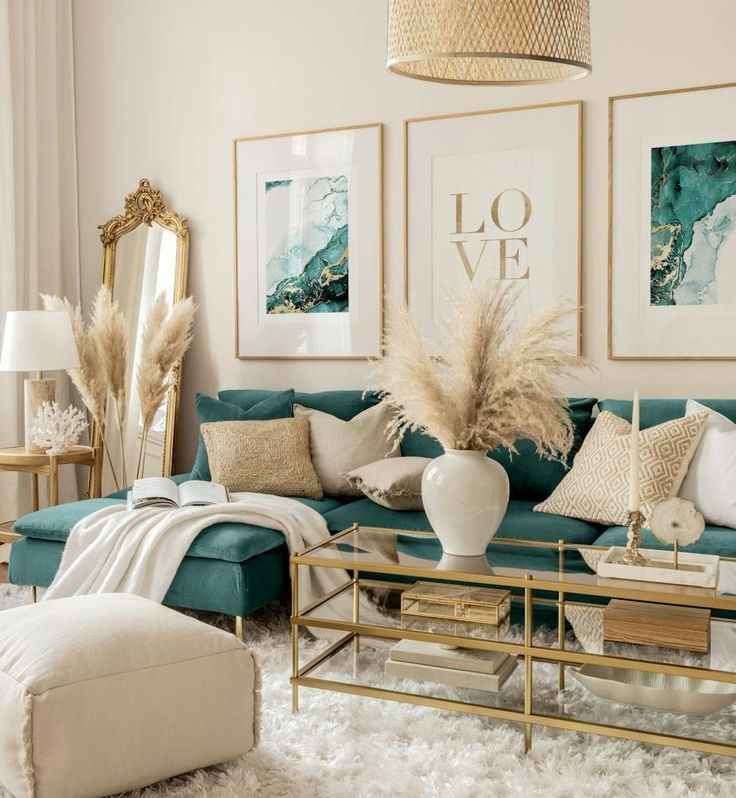 Golden frame art and glass top center table an a teal sofa