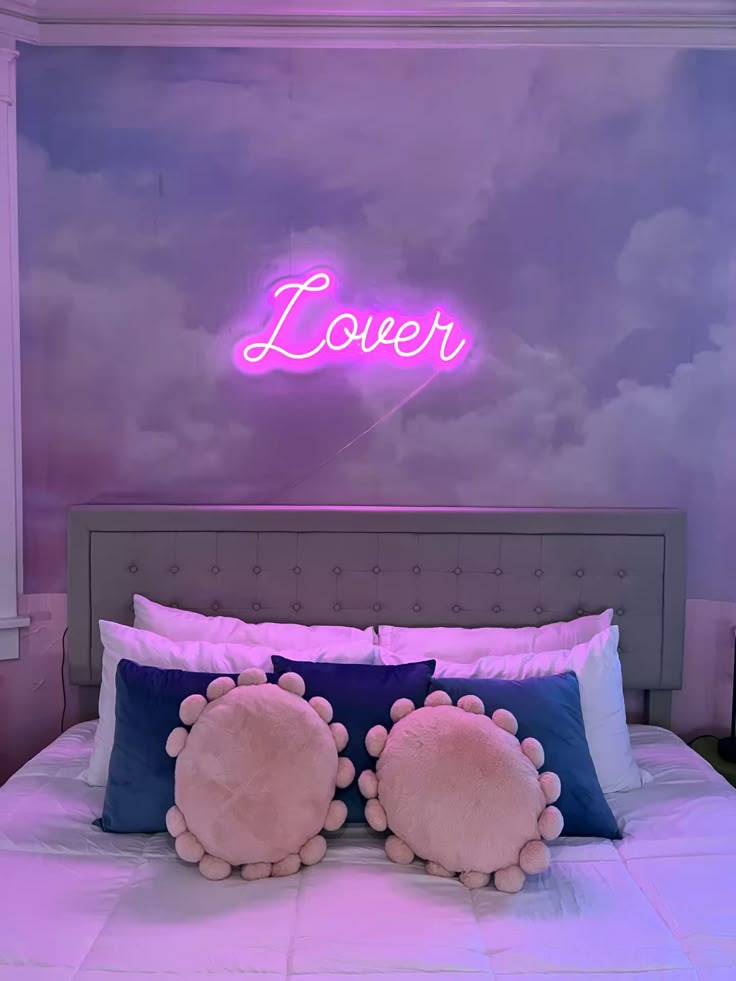 A lover neon sign with a sky backdrop 