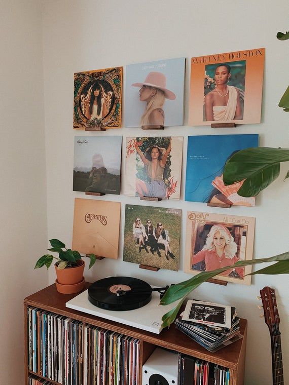 A record player corner and a wooden cabinet and a player placed on it